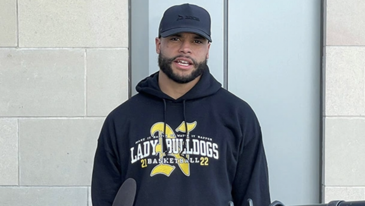 Dak Prescott wearing a Nederland Lady Bulldogs hoodie during a press conference 