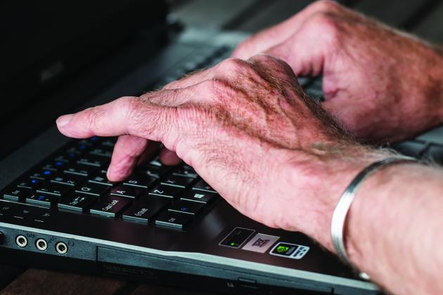 Hands with a laptop computer 
