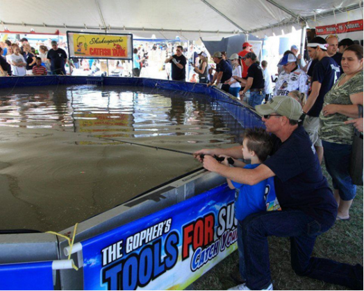 Attendees fish at a stock fishing pond at a previous Disaster Expo 