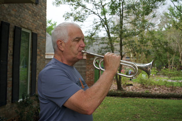  Donald Root plays a bugle donated by a family specifically for his Wounded Warrior Project effort. Those who wish to donate to the Wounded Warrior Project through Root’s cause may scan the QR code and  follow the link