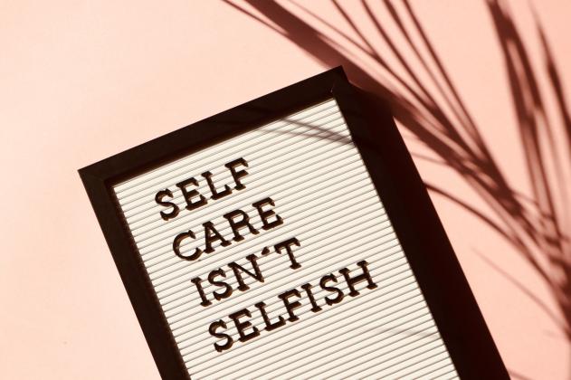 A sign saying self care isn't selfish 