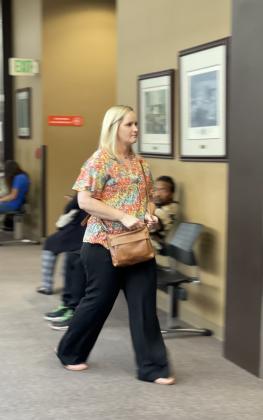 Mary Bond walks into Judge John Stevens' courtroom on May 9, minutes before she was arrested