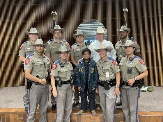 DJ poses with Texas DPS State Troopers 