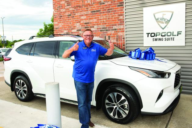 Darren Granger with a 2022 Toyota Highlander raffled off to raise money for Gift of Life 