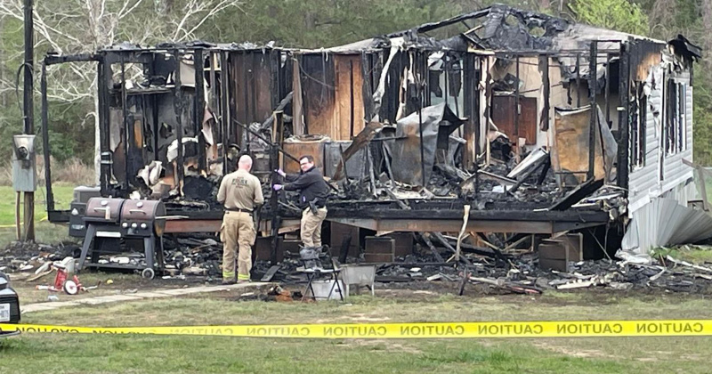 Fire investigators look for evidence on what caused a fire which claimed three lives.