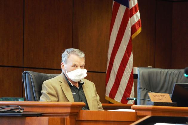 Councilman Mike Getz dons a mask during the April 3 council meeting.