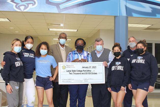 The Rotary Club of Port Arthur presented a $2,000 check to Lamar State College Port Arthur’s Athletics Department this past week to help pay for repairs to the Seahawks’ softball park, Martin Field, after damage caused by Hurricane Delta. Seahawks softball players, from left, Brianna Ramirez, Gabby Tims, Alexa Gracia, LeeAnn Hinojosa, Kaitlyn Samarripa and coach Vance Edwards flank the Rotary Club’s president, Dr. Johnny Brown, Rotary treasurer Mrs. Delilah Francis, and LSCPA Director of Athletics Scott Str