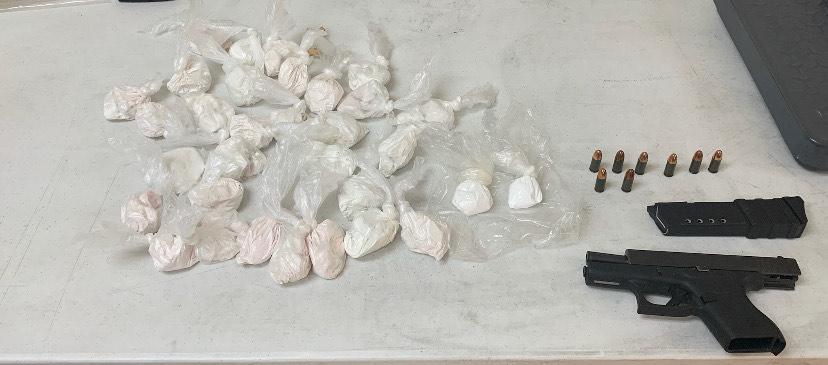 Heroin and a firearm recovered from Lewis 