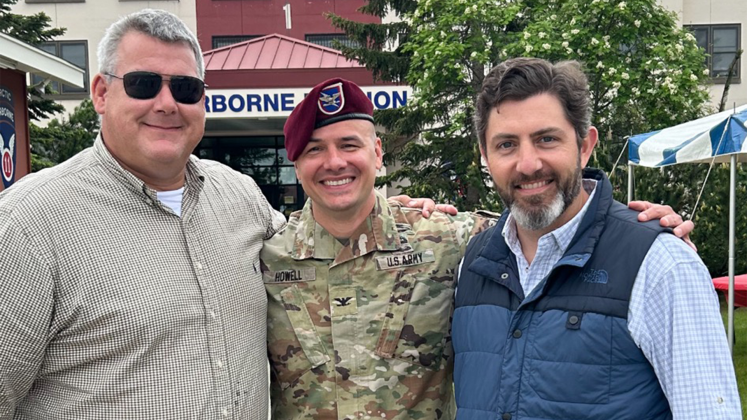 Jefferson County Assistant District Attorney Luke Nichols, Col. James C. Howell, and Jordan Faulk gather at the Change of Command ceremony at Joint Base Elmendorf-Richardson. 