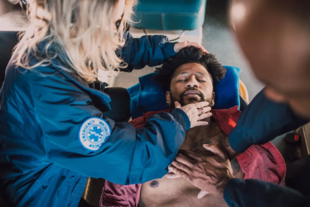 EMS resuscitating a patient 