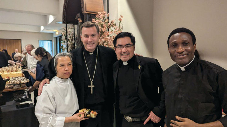 Sister Maria Raphael Tran, Bishop David Toups, Father Phillip Tran and Father Julius Agah