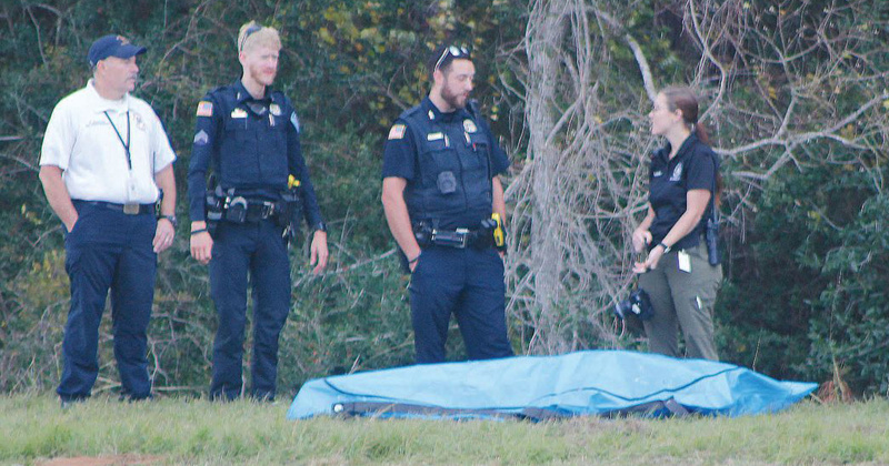 First responders watch over a body pulled from the LNVA canal.