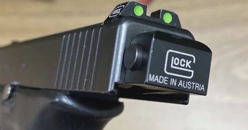 Metal machine gun conversion device with counterfeit Glock branding
