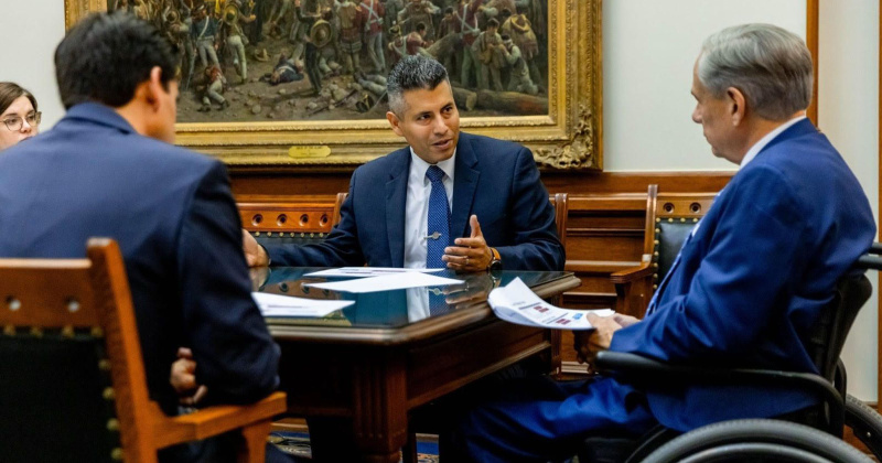 Entergy Texas president & CEO Eliecer Viamontes discusses power plant proposal with Texas Governor Greg Abbott.
